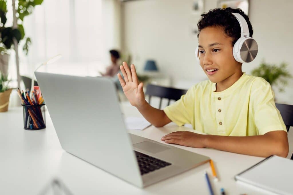 uk key stages. boy learning with a laptop